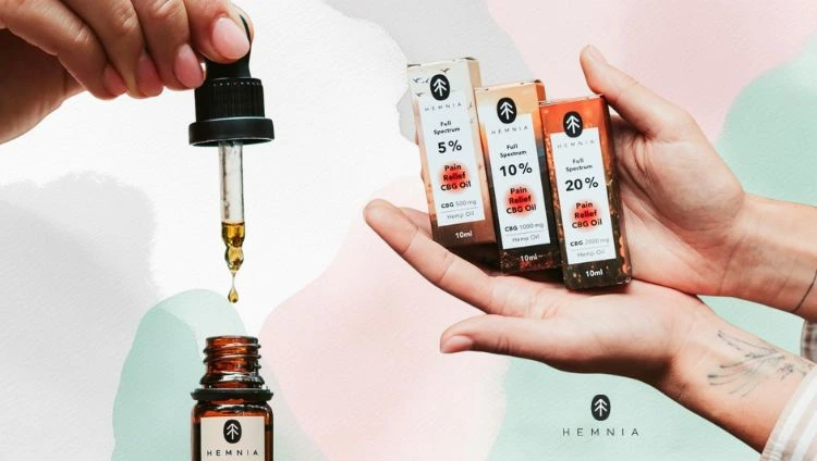 What is CBG oil? Bottles of CBG oil, a dropper and the Hemnia logo bottom right