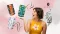 Smiling woman and a pack of CBD Hemnia flowers – the benefits and effects of hemp flowers for relaxation, creativity and inner balance
