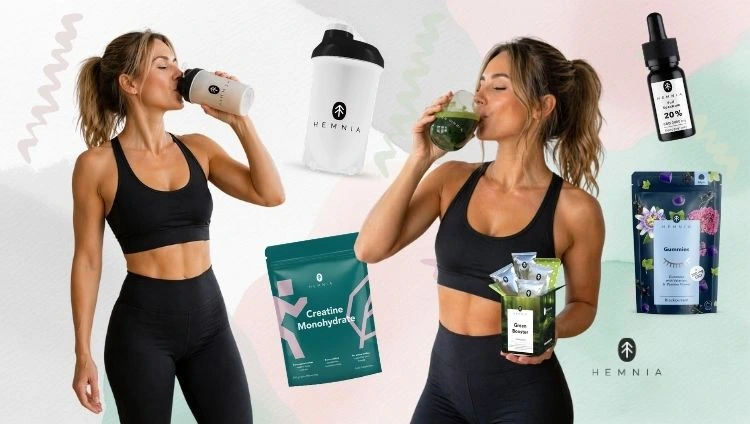 A woman drinking from a shaker, a woman drinking Hemnia Green Booster, with a shaker, creatine, CBD gummies and CBD oil nearby