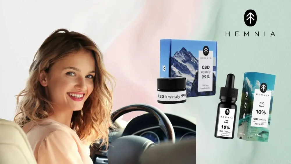 Smiling woman behind the wheel and Hemnia products – 10% CBD oil without THC and 99% CBD crystals